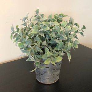 Faux plant in metal pail